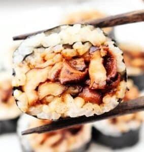 Mushroom Sushi ~ Fresh mushrooms cooked in a savory marinade, then rolled with dried seaweed and Homemade Sushi Rice. Vegetarian and Vegan.