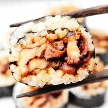 Mushroom Sushi ~ Fresh mushrooms cooked in a savory marinade, then rolled with dried seaweed and Homemade Sushi Rice. Vegetarian and Vegan.