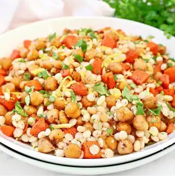 Baharat Chickpea Couscous Baharat Chickpea Couscous ~ Pearl couscous with roasted chickpeas, carrots, and a warm blend of Middle Eastern spices.