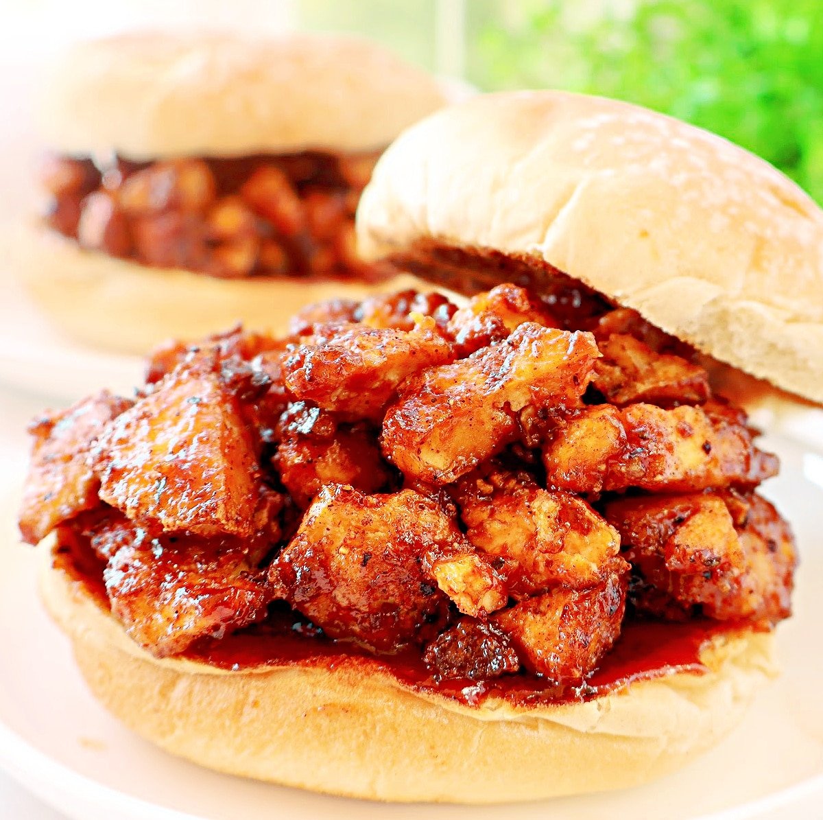 BBQ Tofu Sandwiches ~ Crispy tofu with smoky spices and tangy barbecue sauce piled high on toasted burger buns.