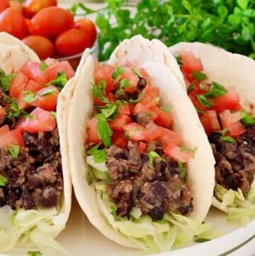 Black Bean Salsa Verde Tacos ~ Quick and easy tacos with hearty black beans, savory seasonings, and smoky green salsa.