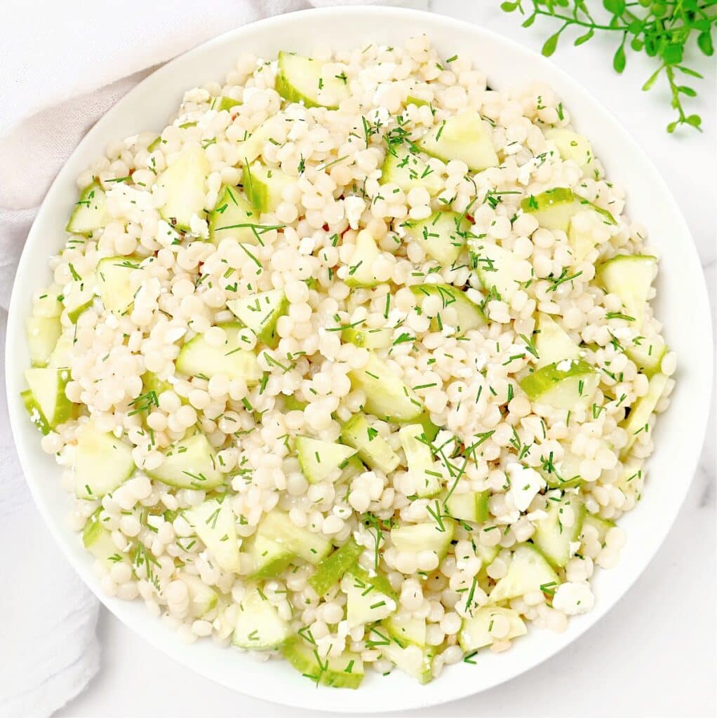Cucumber Couscous Salad ~ Pearled couscous salad with crisp cucumber, fresh dill, and tangy feta tossed in zesty Italian dressing.