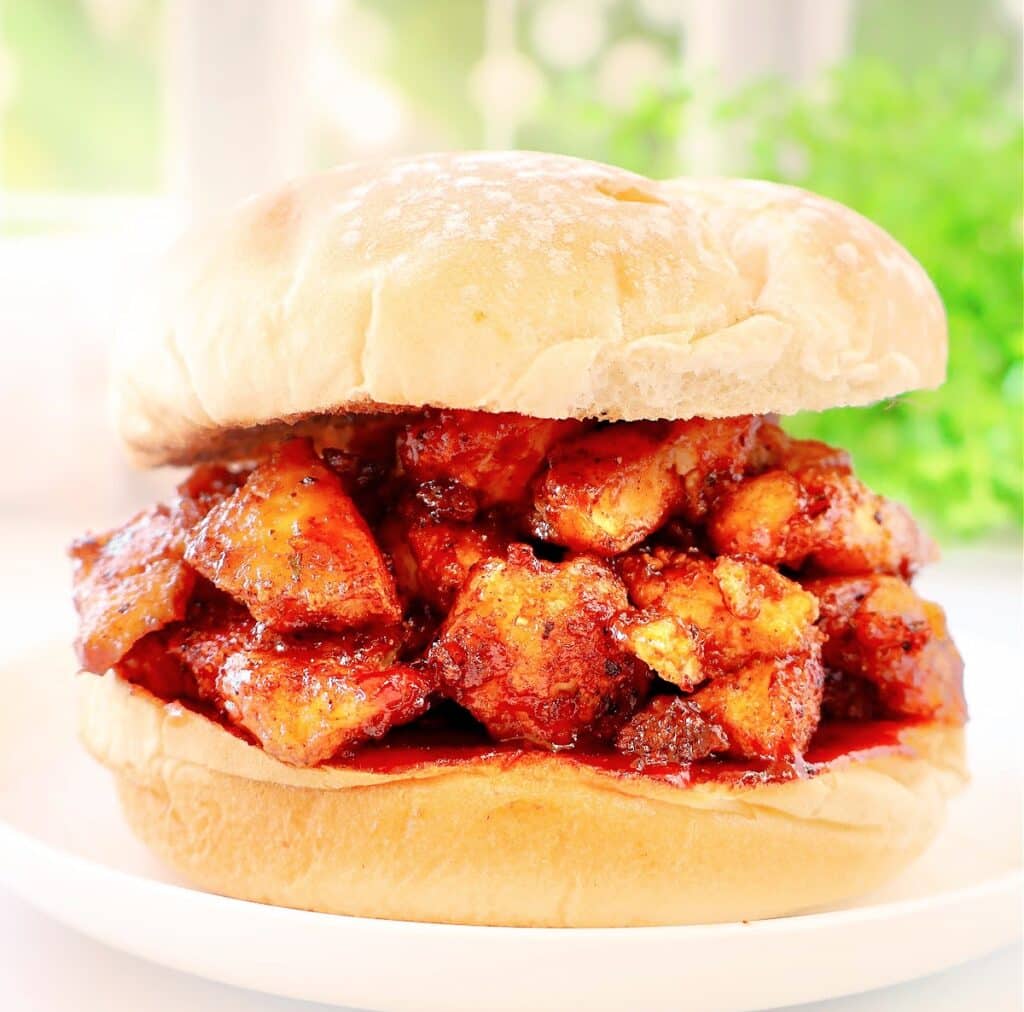 BBQ Tofu Sandwiches ~ Crispy tofu with smoky spices and tangy barbecue sauce piled high on toasted burger buns.