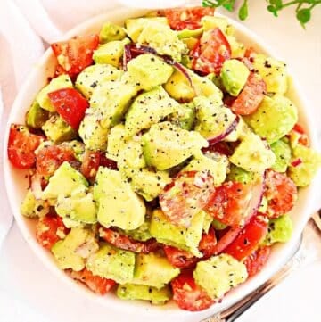 Avocado Tomato Salad ~ Fresh tomatoes and creamy avocado tossed in a light, tangy dressing.
