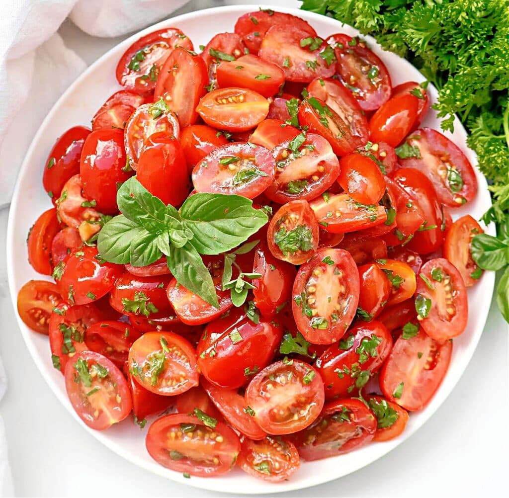 Grape Tomato Salad ~ Garden fresh tomatoes and herbs in a simple vinaigrette. A healthy side dish that highlights flavors of the season.