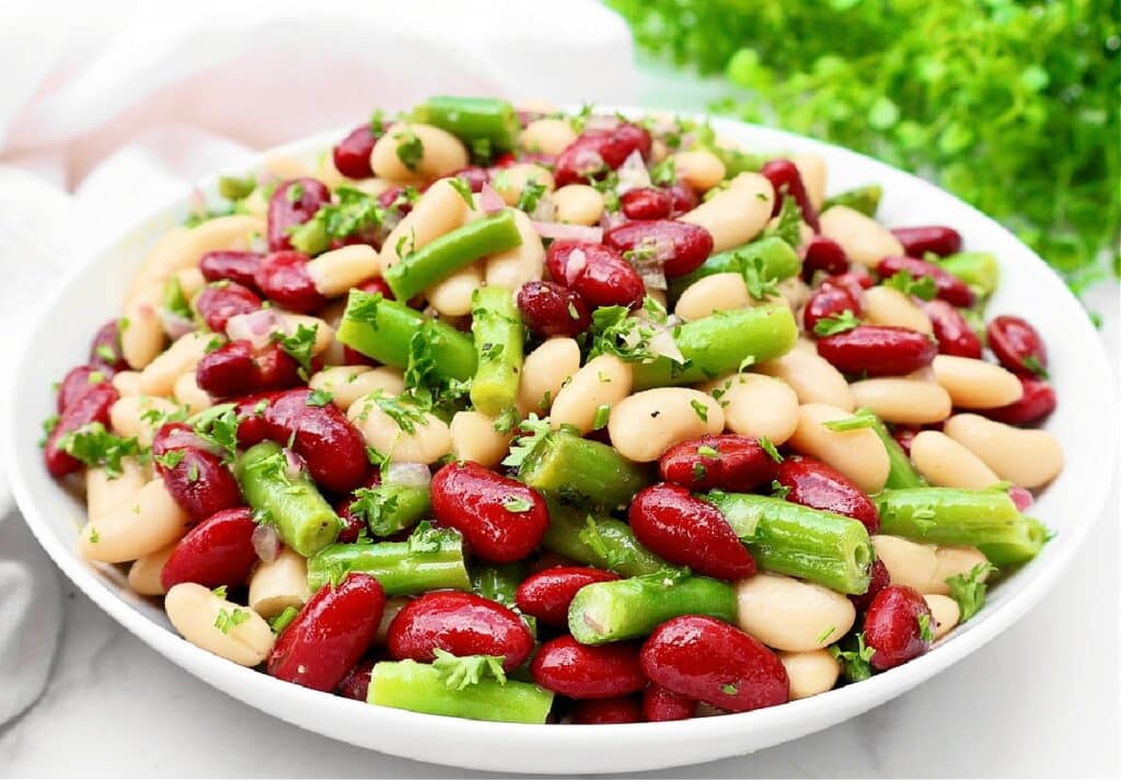 Three Bean Salad ~ A vibrant and refreshing blend of colorful beans tossed in a tangy dressing. A summer favorite!