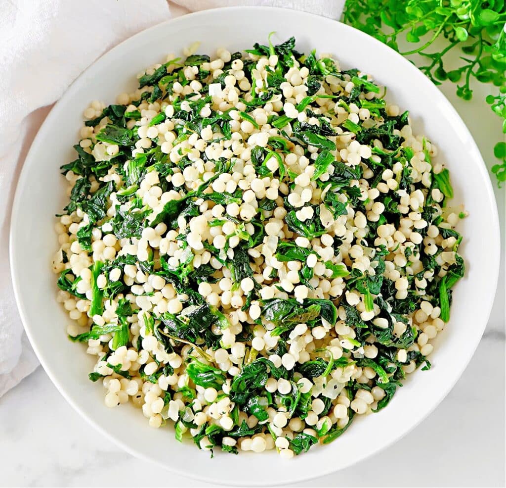 Spinach Couscous ~ An easy and budget-friendly Mediterranean-inspired dish that blends hearty pearl couscous with savory spinach.