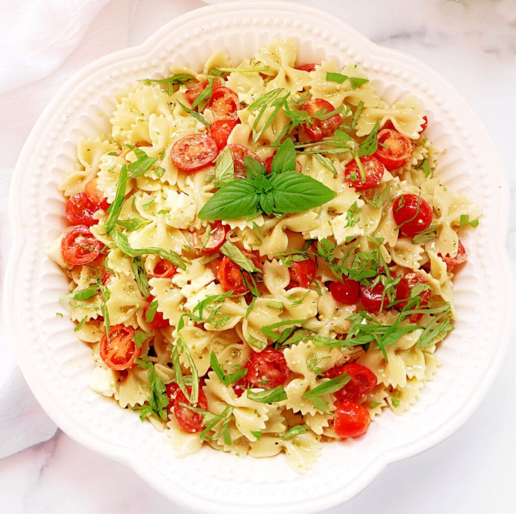 Caprese Pesto Pasta Salad ~ The vibrant flavors of classic Caprese salad in an easy-to-make pasta dish that's always a crowd favorite!