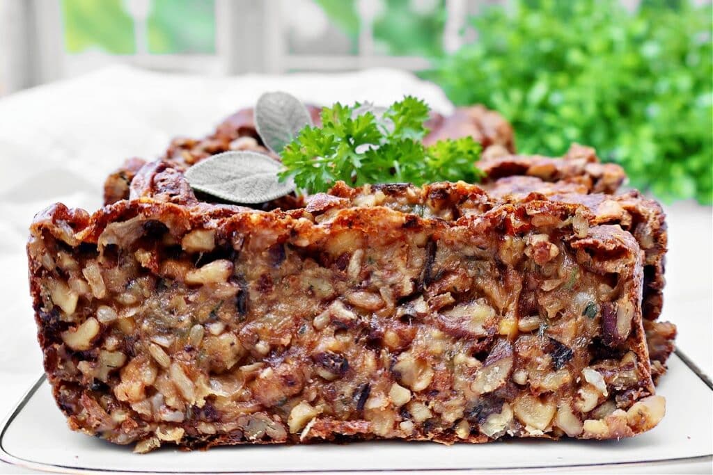 Vegetarian Nut Roast ~ A rich, protein-packed loaf with nuts, wild rice, garbanzo beans, and savory herbs, perfect for Thanksgiving or Christmas dinner.