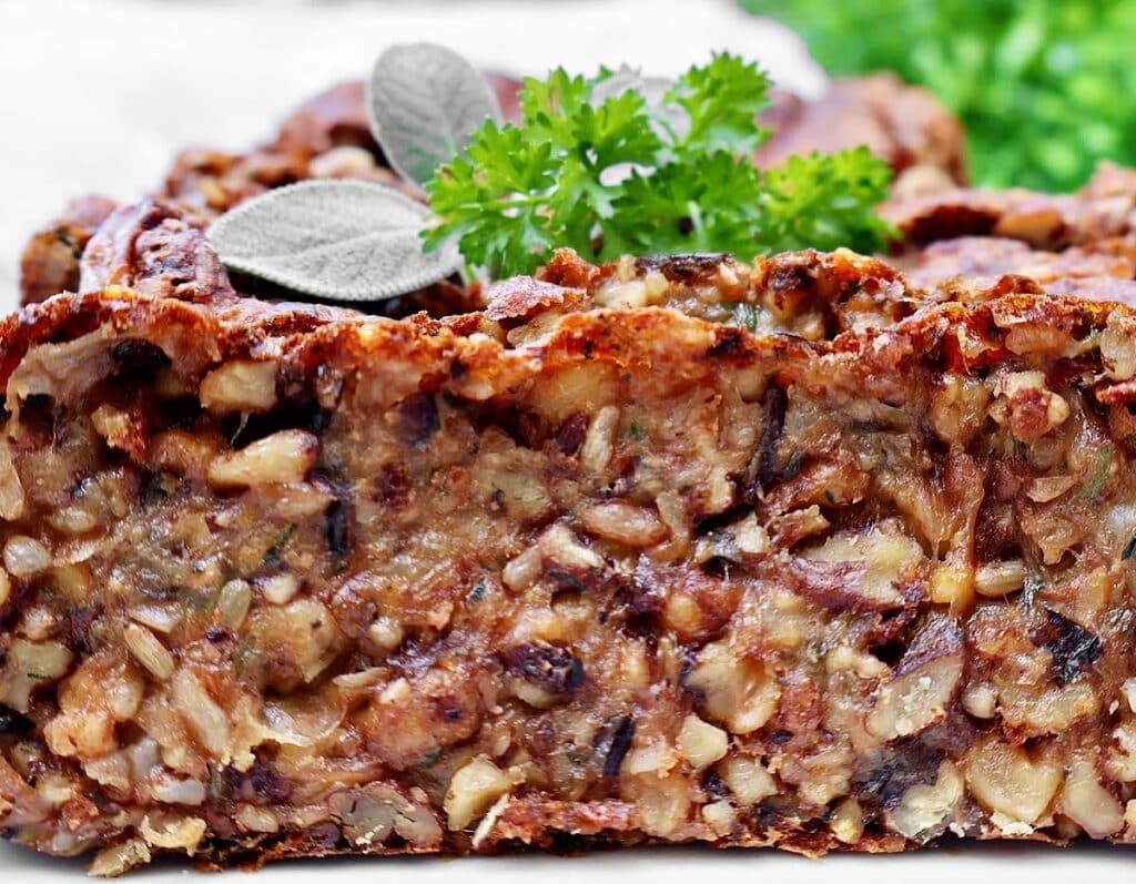 Vegetarian Nut Roast ~ A rich, protein-packed loaf with nuts, wild rice, garbanzo beans, and savory herbs, perfect for Thanksgiving or Christmas dinner.