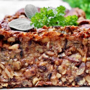 Vegetarian Nut Roast ~ A rich, protein-packed loaf with nuts, wild rice, garbanzo beans, and savory herbs, perfect for Thanksgiving or Christmas dinner.