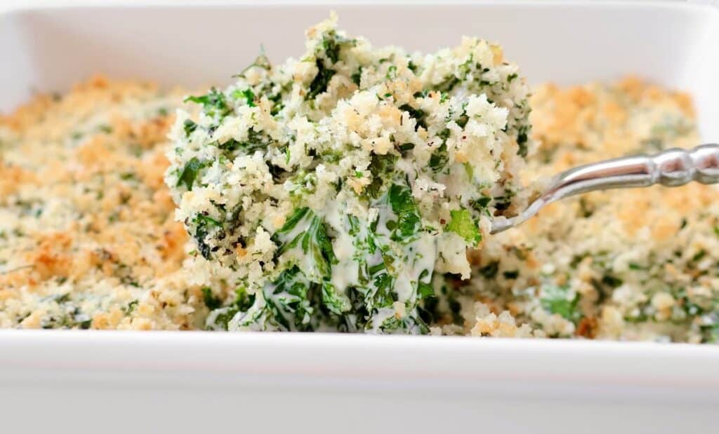 Kale Casserole ~ Fresh kale baked in savory cream sauce and topped with buttery breadcrumbs. Vegetarian or vegan.