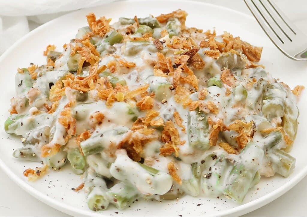 Slow Cooker Green Bean Casserole ~ Tender green beans in a creamy mushroom sauce, topped with crispy fried onions. Easy vegetarian side dish.