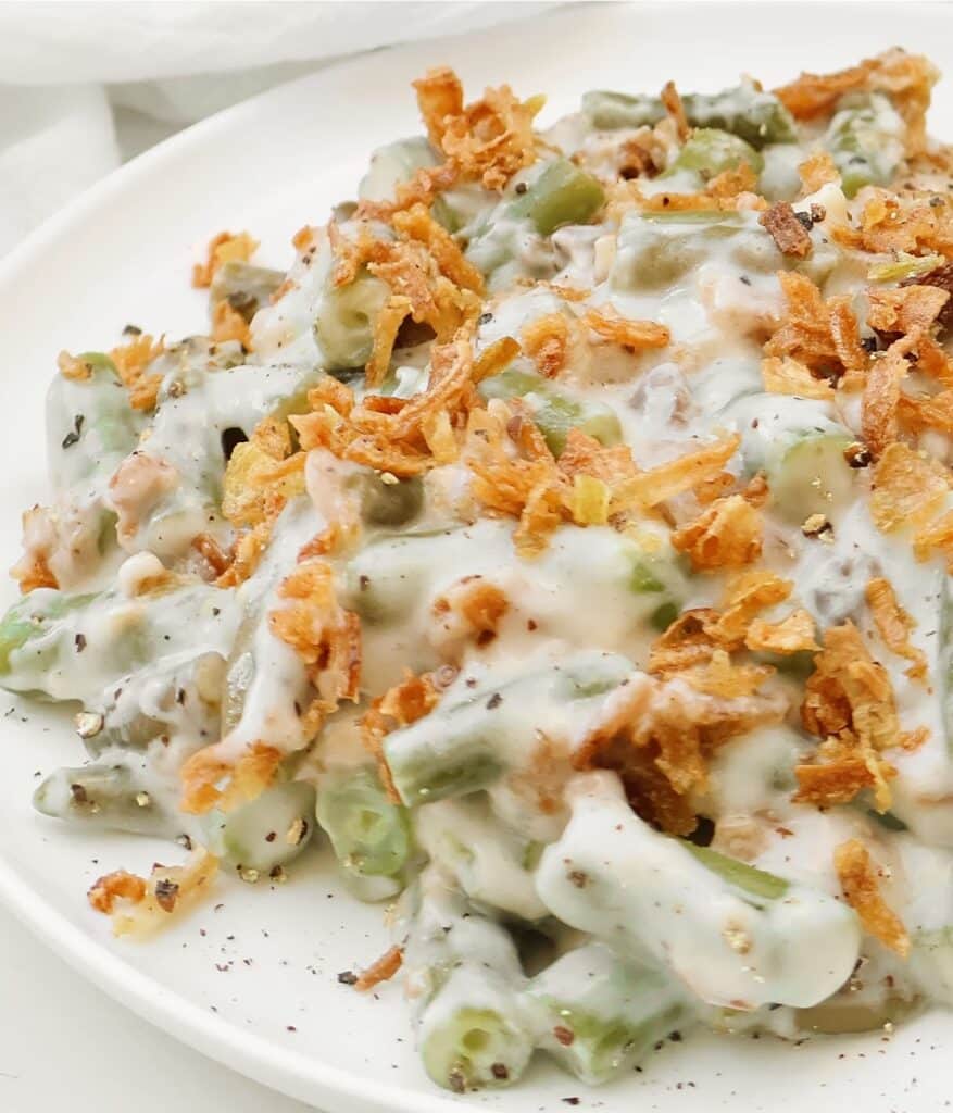 Slow Cooker Green Bean Casserole ~ Tender green beans in a creamy mushroom sauce, topped with crispy fried onions. Easy vegetarian side dish.