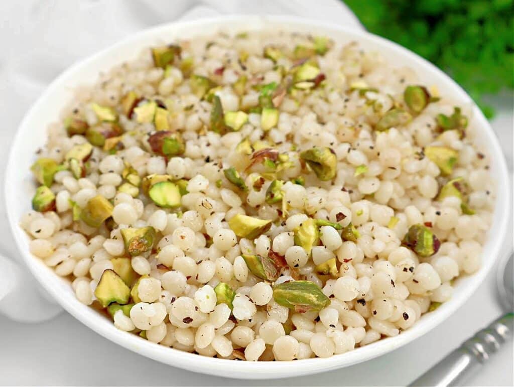 Pistachio Couscous ~ Quick and simple recipe for lightly seasoned pearl couscous studded with crunchy pistachios.