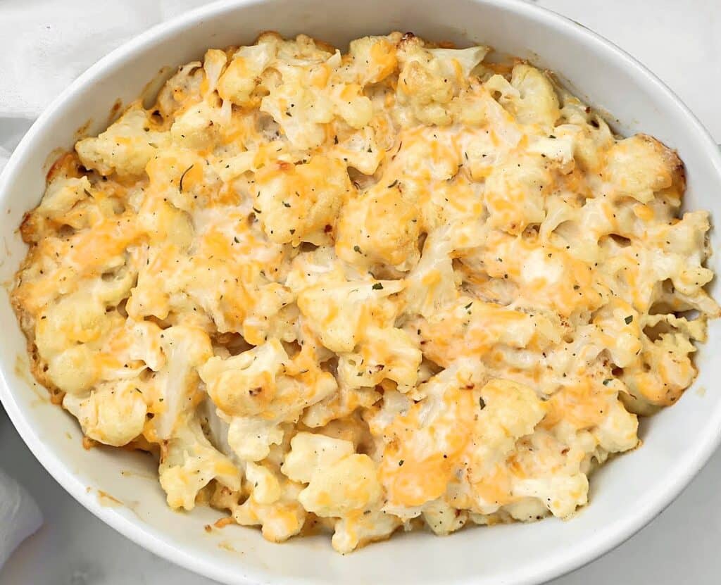 Cheesy Ranch Cauliflower ~ Roasted cauliflower florets in a rich ranch-infused cheese sauce. Vegetarian or Vegan.