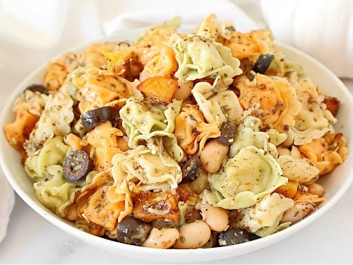 Tortellini with Pumpkin and White Beans ~ Cozy one-pot pasta dinner that's perfect for the fall season! Vegetarian or vegan.