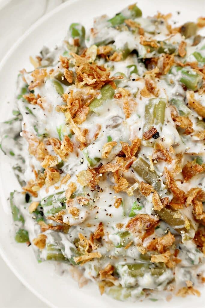 Slow Cooker Green Bean Casserole ~ Tender green beans in a creamy mushroom sauce, topped with crispy fried onions. Easy vegetarian side dish.