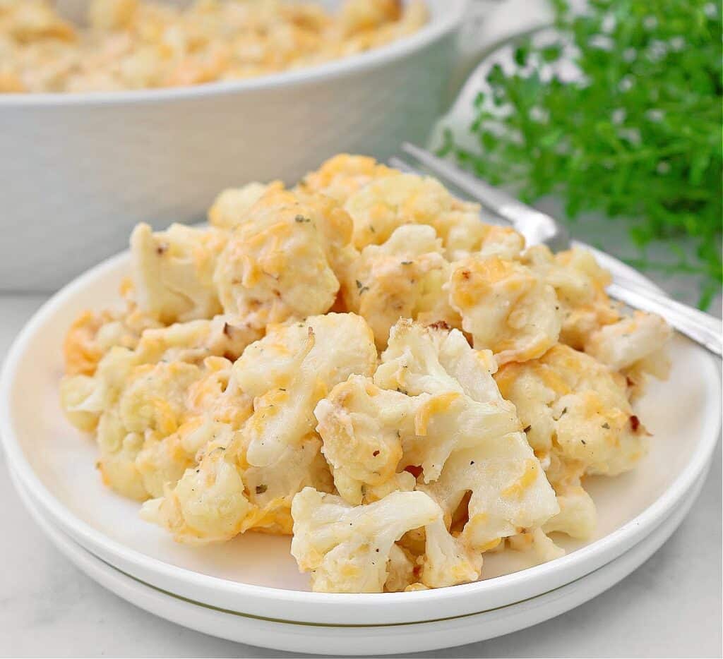 Cheesy Ranch Cauliflower ~ Roasted cauliflower florets in a rich ranch-infused cheese sauce. Vegetarian or Vegan.