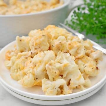 Cheesy Ranch Cauliflower ~ Roasted cauliflower florets in a rich ranch-infused cheese sauce. Vegetarian or Vegan.