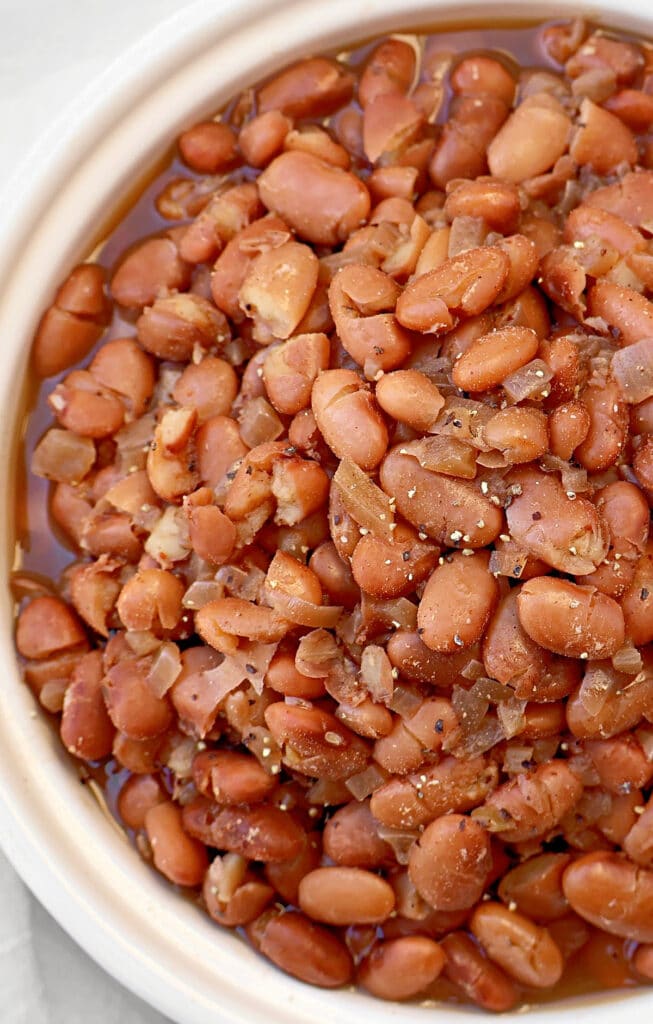 ​Slow Cooker Pinto Beans Recipe ~ Dry pinto beans slow-cooked with warm, aromatic spices. Vegetarian and vegan.