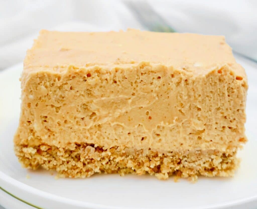 Pumpkin Cheesecake Bars ~ Easy and creamy no-bake fall dessert with a buttery graham cracker crust and spiced pumpkin cheesecake filling.