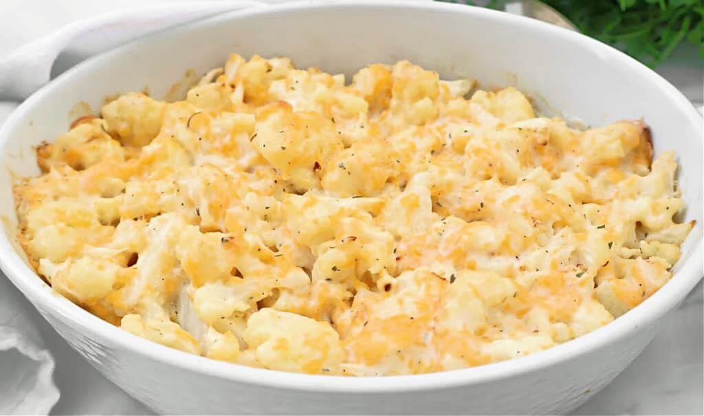 Cheesy Ranch Cauliflower ~ Roasted cauliflower florets in a rich ranch-infused cheese sauce. Vegetarian or Vegan.