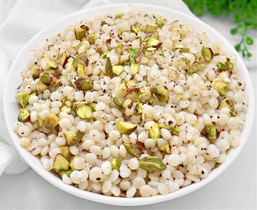 Pistachio Couscous ~ Quick and simple recipe for lightly seasoned pearl couscous studded with crunchy pistachios.