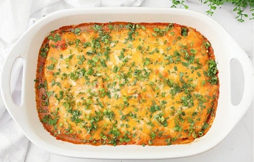 Tamale Casserole ~ Easy and comforting Tex-Mex dish made with your favorite premade tamales and a rich, cheesy sauce.