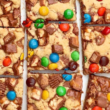 Halloween Candy Cookie Bars ~ Got leftover Halloween candy? Turn those fun-sized chocolate bars into chewy, buttery cookie bars.