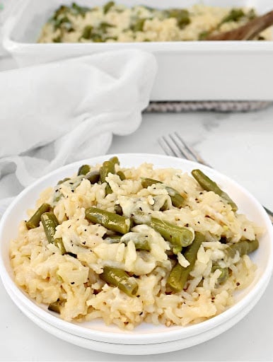 Green Bean Rice Casserole ~ Oven-baked rice with tender green beans, topped with a savory cheese blend. Easy Vegetarian or Vegan side dish.