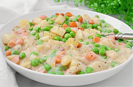 Crustless Veggie Pot Pie ~ All the filling of a classic pot pie with none of the crust! Serve over biscuits for a hearty homestyle dinner.