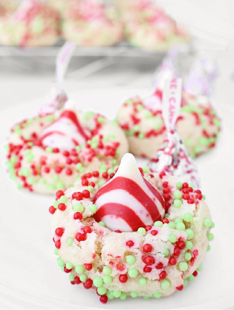 Candy Cane Kiss Cookies ~ Peppermint-infused sugar cookies topped with Hershey's Candy Cane Kisses. Perfect cookie for a cookie exchange!