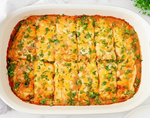 Tamale Casserole ~ Easy and comforting Tex-Mex dish made with your favorite premade tamales and a rich, cheesy sauce.