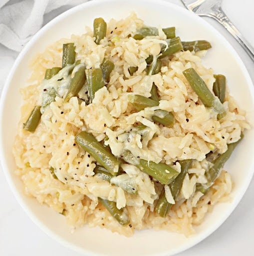 Green Bean Rice Casserole ~ Oven-baked rice with tender green beans, topped with a savory cheese blend. Easy Vegetarian or Vegan side dish.