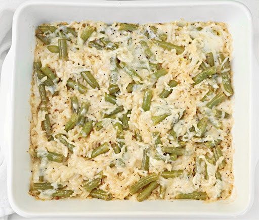 Green Bean Rice Casserole ~ Oven-baked rice with tender green beans, topped with a savory cheese blend. Easy Vegetarian or Vegan side dish.