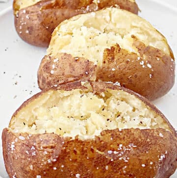 Slow Cooker Baked Potatoes ~ Cooking potatoes in the crockpot is an easy way to make perfectly fluffy and tender baked potatoes every time!