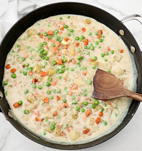 Crustless Veggie Pot Pie ~ All the filling of a classic pot pie with none of the crust! Serve over biscuits for a hearty homestyle dinner.