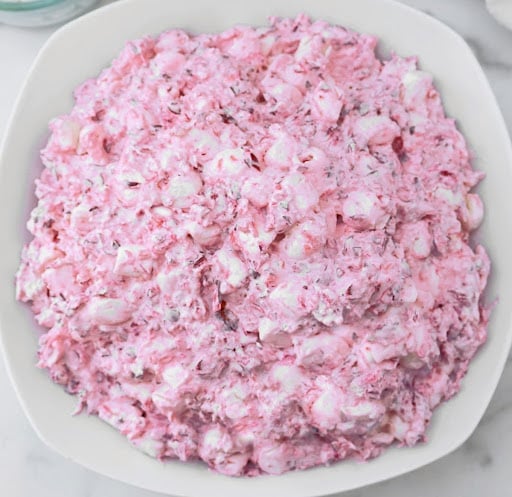 Cranberry Fluff ~ A fluffy blend of tart cranberries, sweet marshmallows, and pineapple that sneaks onto the table as “salad.”