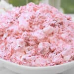 Cranberry Fluff ~ A fluffy blend of tart cranberries, sweet marshmallows, and pineapple that sneaks onto the table as “salad.”