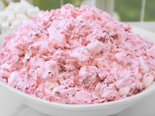 Cranberry Fluff ~ A fluffy blend of tart cranberries, sweet marshmallows, and pineapple that sneaks onto the table as “salad.”