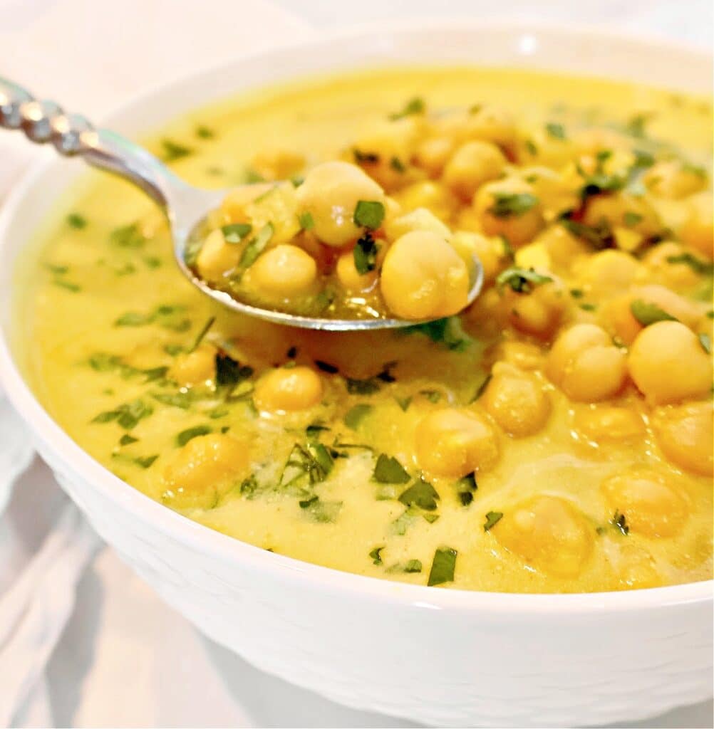 Chickpea Curry Soup ~ Protein-packed chickpeas (garbanzo beans) and warm spices in a comforting soup. Ready in 20 minutes. Vegetarian and Vegan.