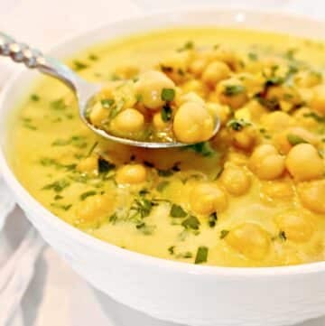 Chickpea Curry Soup ~ Protein-packed chickpeas (garbanzo beans) and warm spices in a comforting soup. Ready in 20 minutes. Vegetarian and Vegan.