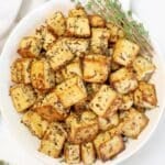 Lemon Herb Tofu ~ Golden-brown tofu marinated in zesty lemon juice, Dijon mustard, garlic, and herbs, then pan-fried to crispy perfection. Easy vegan recipe!