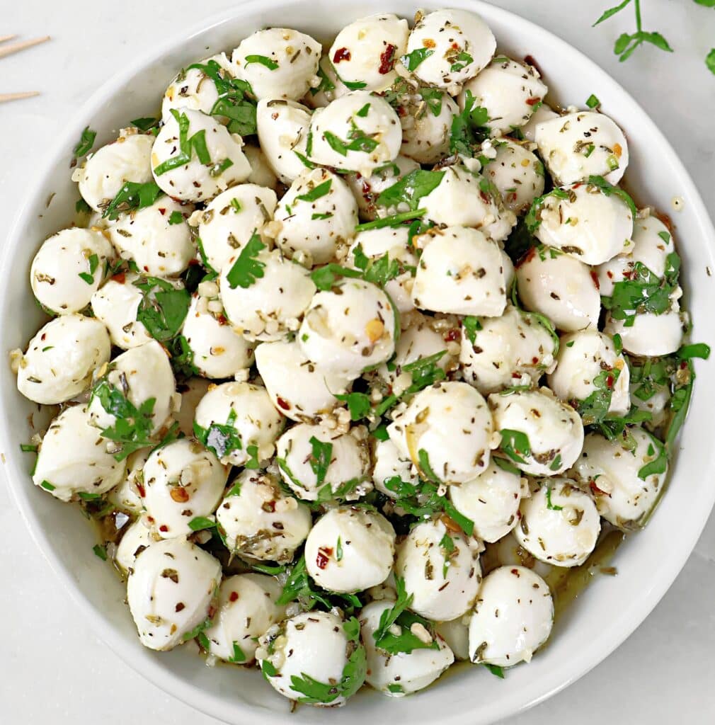 Marinated Mozzarella Balls ~ Fresh mozzarella pearls marinated in a blend of olive oil, herbs, and garlic.