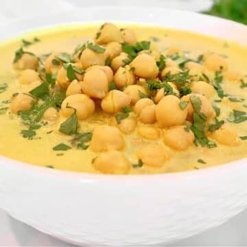 Chickpea Curry Soup ~ Protein-packed chickpeas (garbanzo beans) and warm spices in a comforting soup. Ready in 20 minutes. Vegetarian and Vegan.