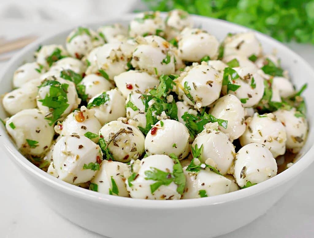 Marinated Mozzarella Balls ~ Fresh mozzarella pearls marinated in a blend of olive oil, herbs, and garlic.