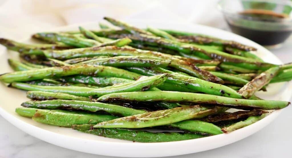 Blistered Green Beans ~ Chinese-style recipe featuring fresh green beans pan-seared with garlic and soy sauce.