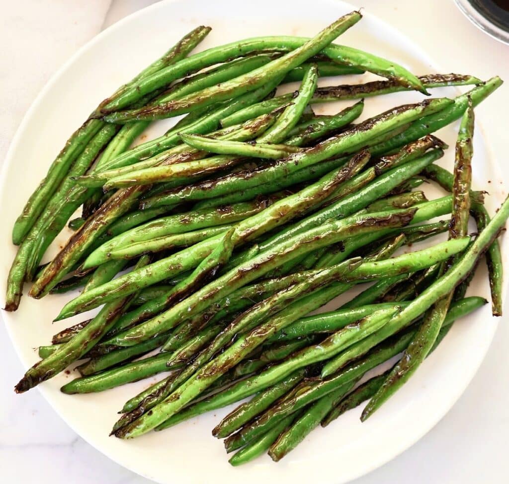 Blistered Green Beans ~ Chinese-style recipe featuring fresh green beans pan-seared with garlic and soy sauce.