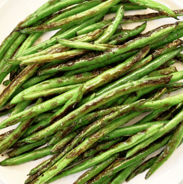 Blistered Green Beans ~ Chinese-style recipe featuring fresh green beans pan-seared with garlic and soy sauce.